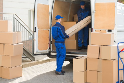 Professional packing services preparing boxes in a Hackney home