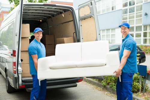 Movers organizing household belongings for relocation in Hackney