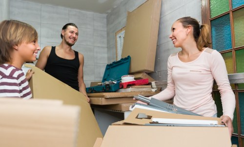 Professional office relocation services in Hackney with packed boxes and moving tools