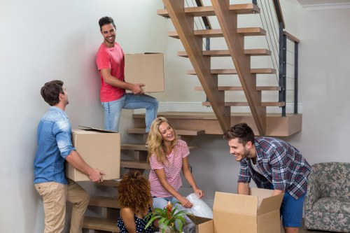 Removal team handling items carefully during a safe move