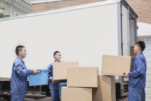 Specialist movers navigating a Hackney property with a piano