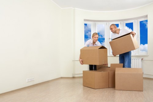Staff wearing PPE while moving furniture in Hackney