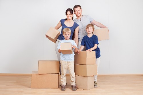 Planned business move with labelled office boxes and workspace setup in Hackney