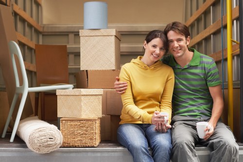 Packed moving boxes and furniture prepared for flat removals in Hackney