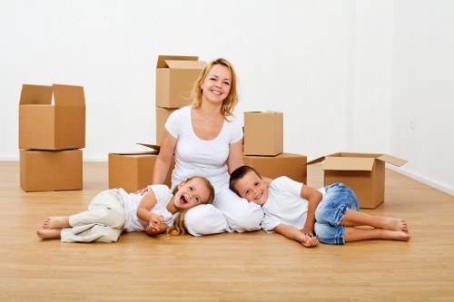 Trained movers protecting and loading household furniture in Hackney