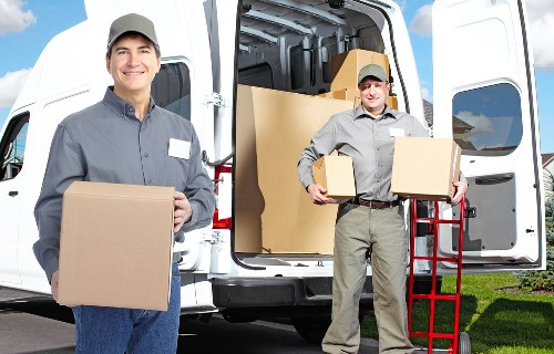 Packed moving boxes inside a Hackney flat ready for transport