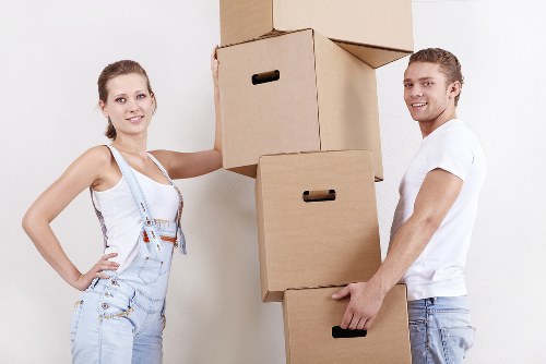 Packed moving boxes and furniture ready for urgent removal in Hackney