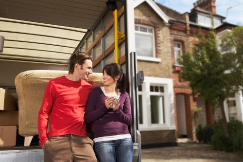 Unpacking services arranging items in a new Hackney property