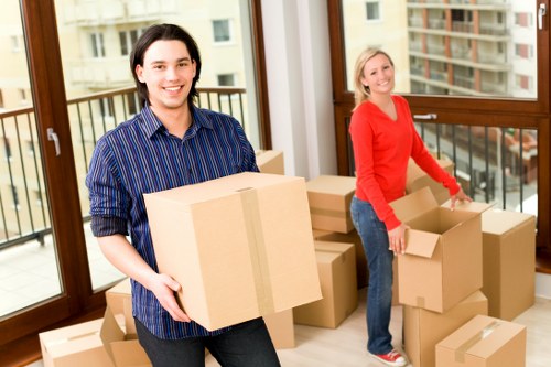 A residential move in Hackney with furniture being carried downstairs